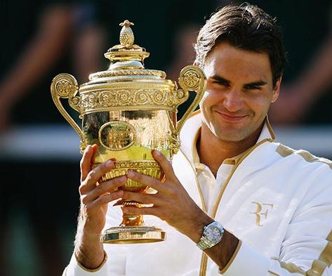 Roger Federer wears the luxury watch fake Rolex Datejust II with silvery dial with Arabic numerals and date window.